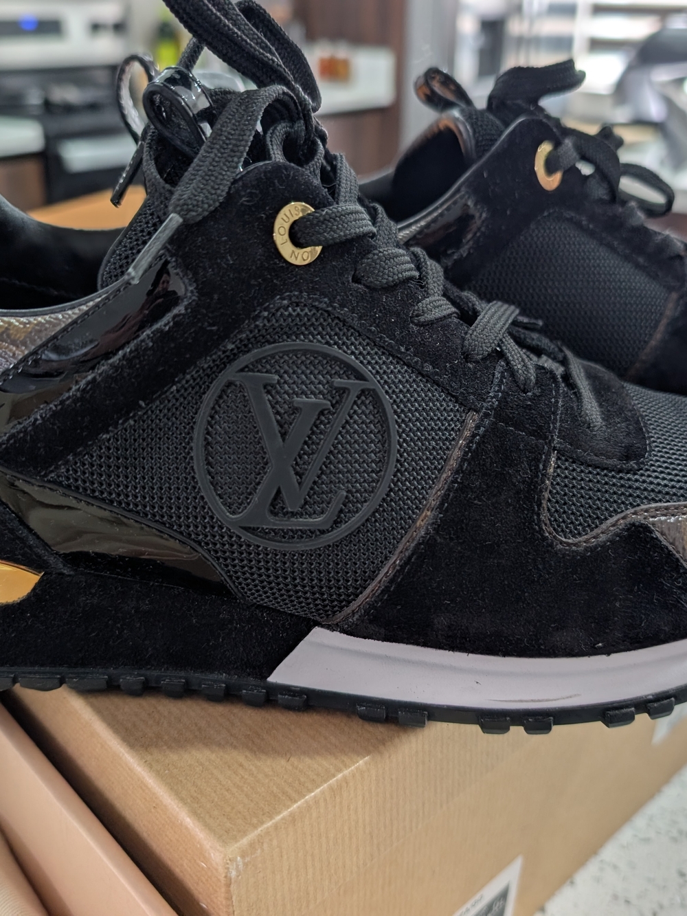 Louis Vuitton Black Women’s Sneaker with Gold Accents